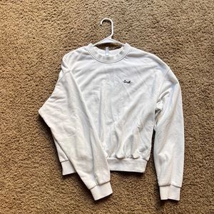 White Crew Neck with smile embroidered on the leftside